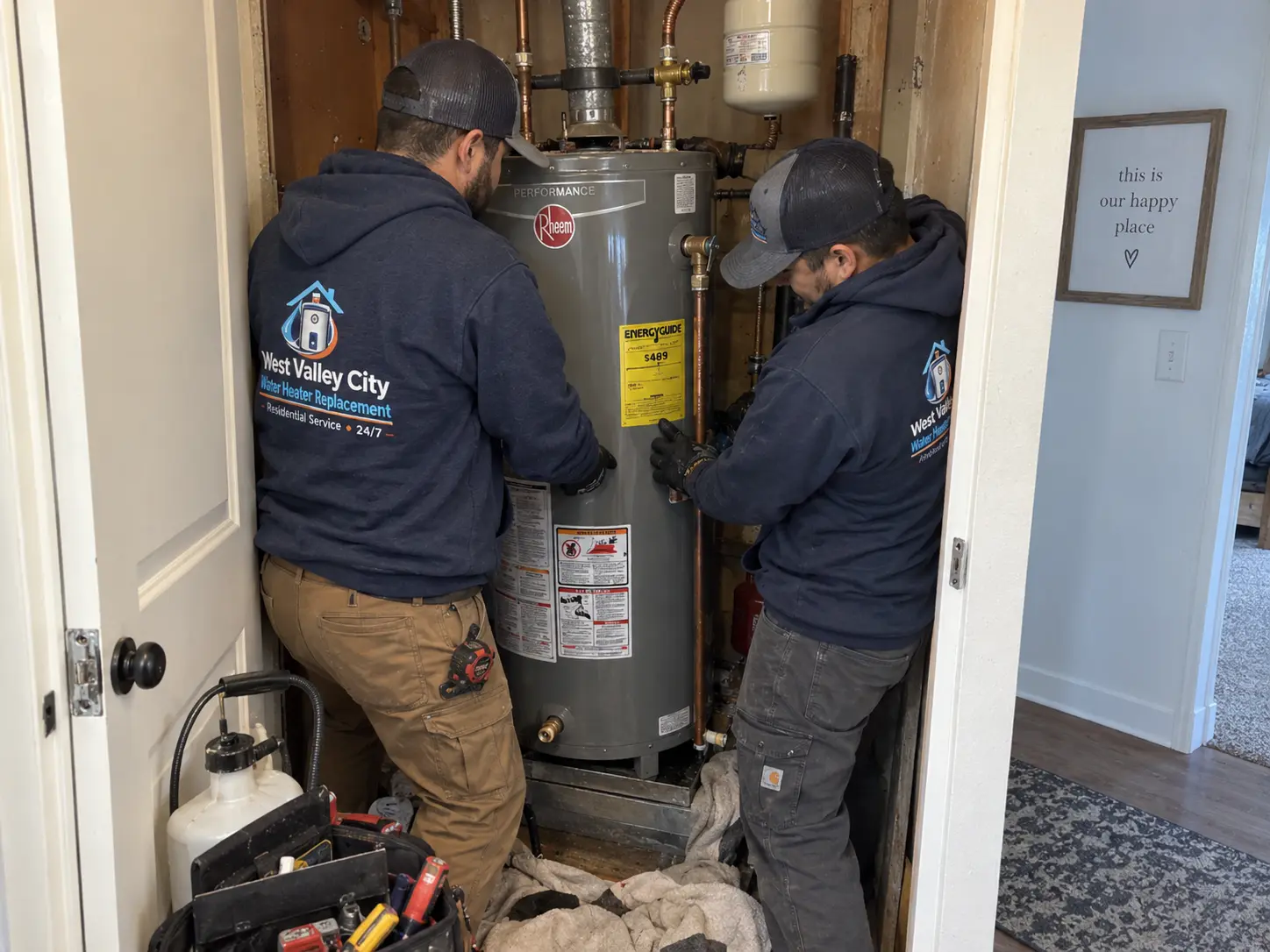 Residential technicians replacing a water heater in West Valley City